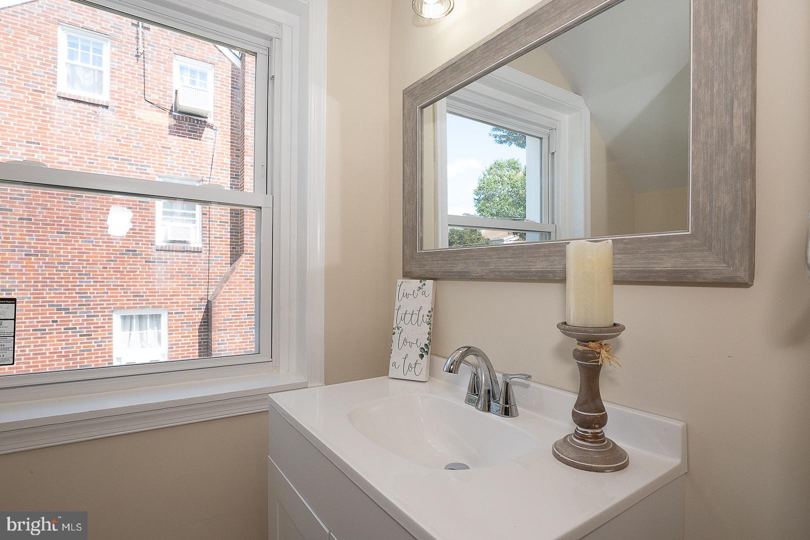 632 Merion Avenue Upper Darby, PA 19082 - Photo 46 of 84 a bathroom with a sink and a window