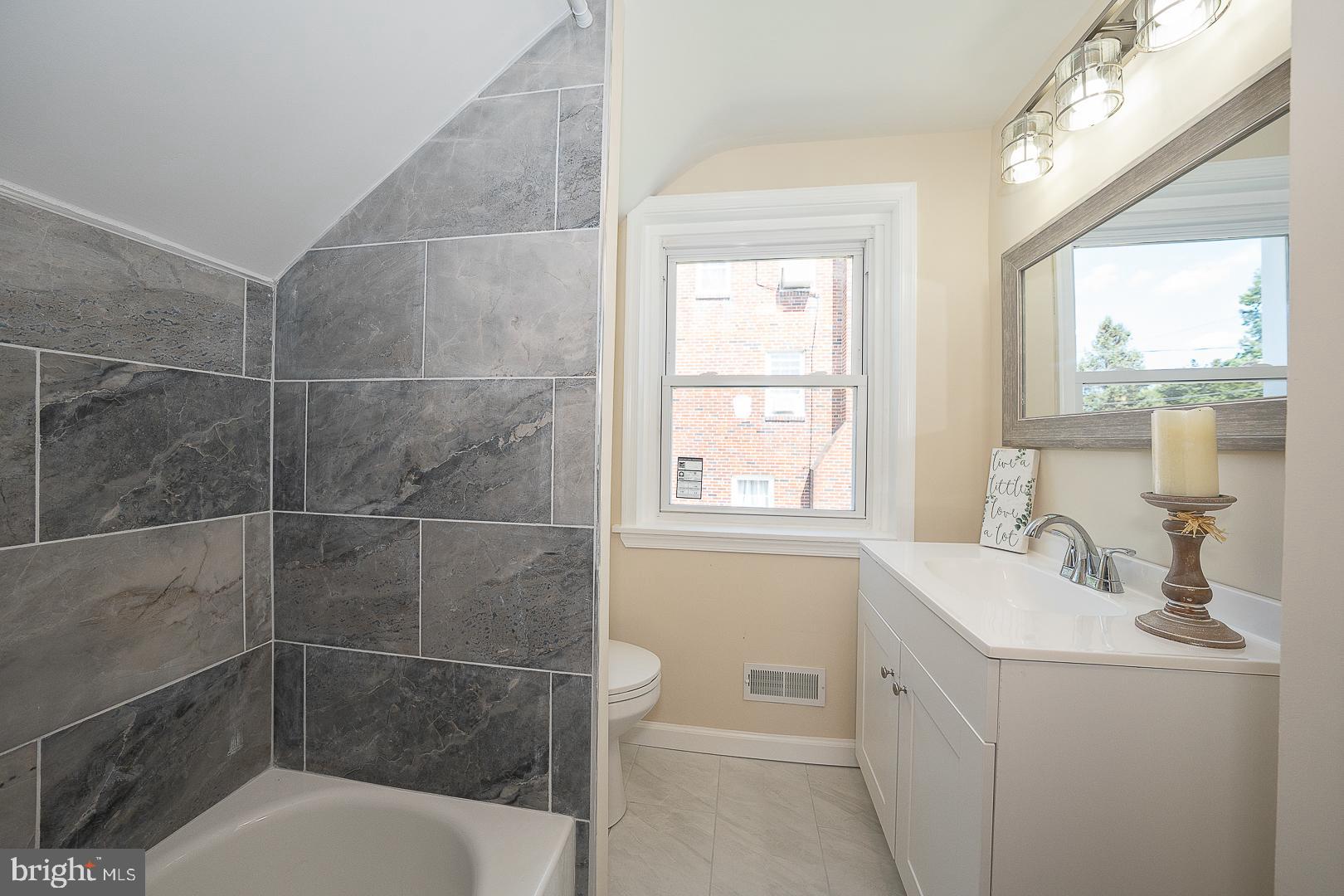 632 Merion Avenue Upper Darby, PA 19082 - Photo 50 of 84 a bathroom with a sink a toilet and shower