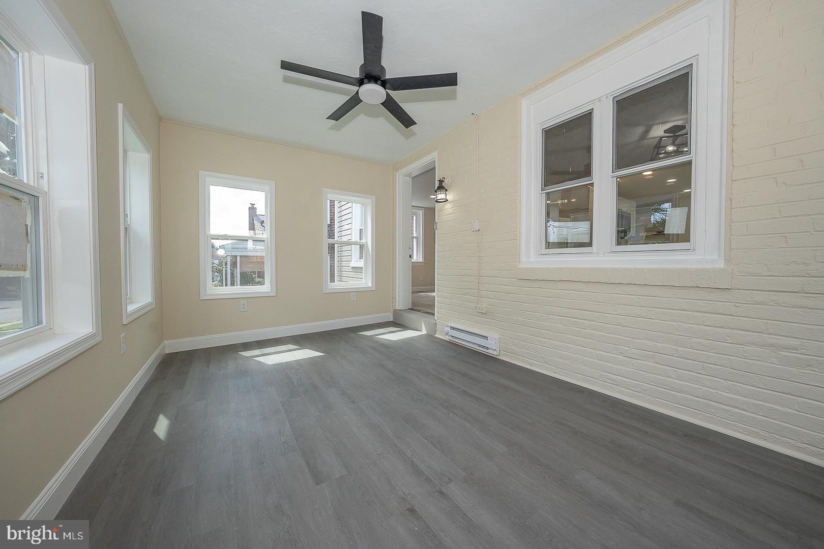632 Merion Avenue Upper Darby, PA 19082 - Photo 6 of 84 a view of an empty room with a window and wooden floor
