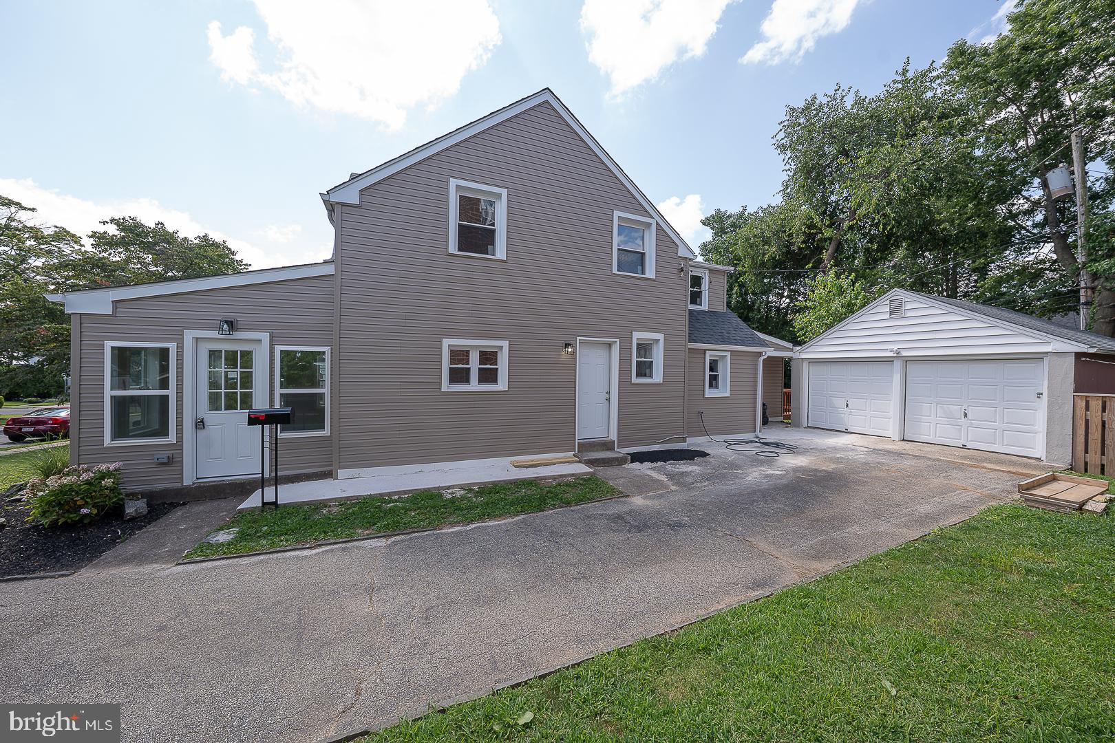 632 Merion Avenue Upper Darby, PA 19082 - Photo 68 of 84 a front view of a house with a yard and garage