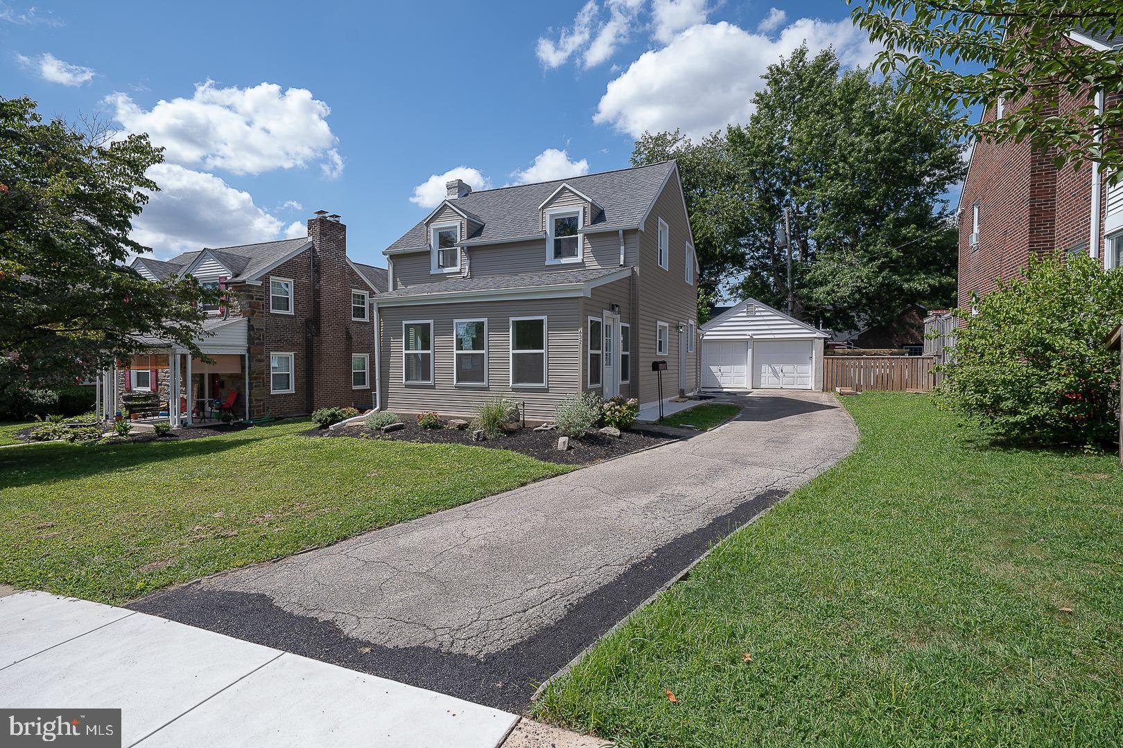 632 Merion Avenue Upper Darby, PA 19082 - Photo 83 of 84 a front view of a house with a garden and plants