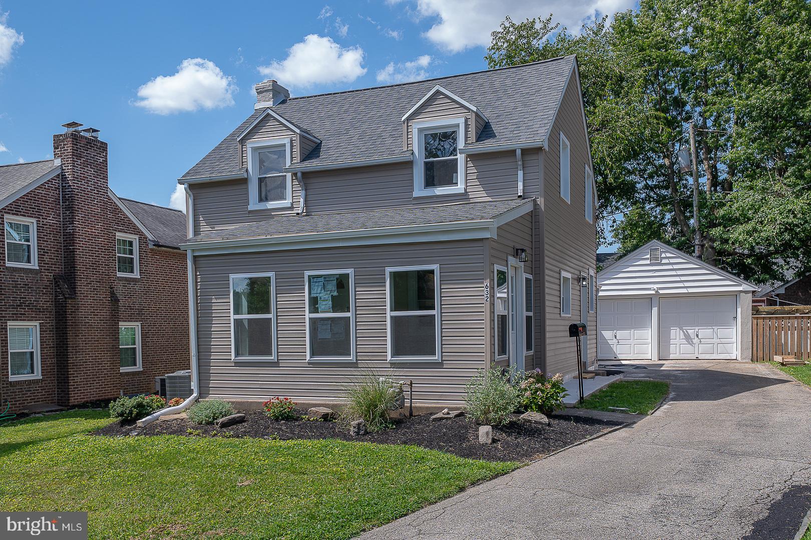 632 Merion Avenue Upper Darby, PA 19082 - Photo 84 of 84 a front view of a house with a garden and plants