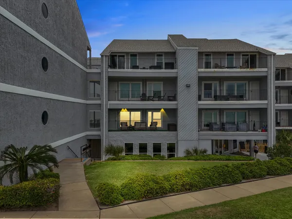 a front view of a building with garden