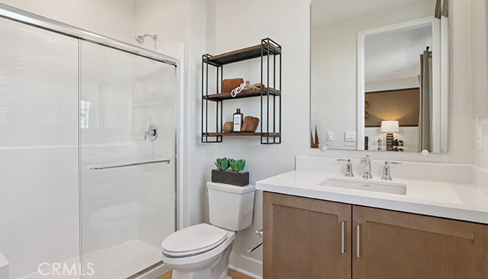 18318 Mystic Court Riverside, CA 92508 - Photo 11 of 47 a bathroom with a sink toilet and a mirror