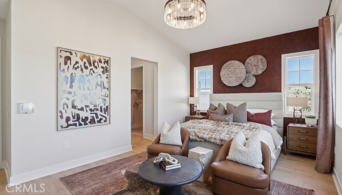 18318 Mystic Court Riverside, CA 92508 - Photo 23 of 47 a bedroom with a bed and a table with wall paintings