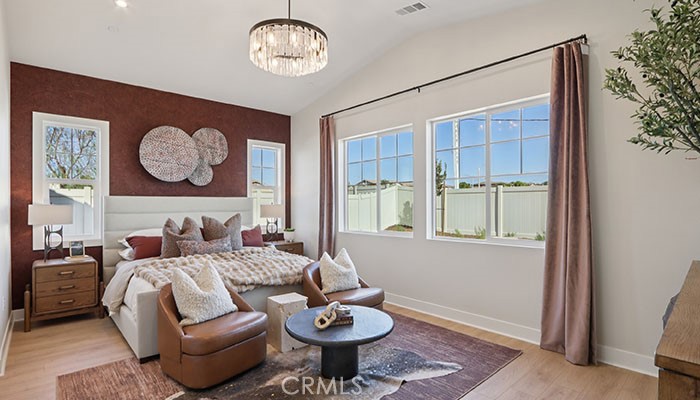 18318 Mystic Court Riverside, CA 92508 - Photo 24 of 47 a living room with furniture a window and a potted plant