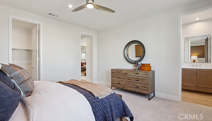 18318 Mystic Court Riverside, CA 92508 - Photo 25 of 47 a bedroom with a bed and a chandelier