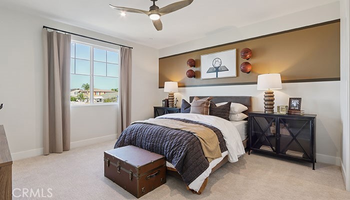 18318 Mystic Court Riverside, CA 92508 - Photo 26 of 47 a bedroom with a bed lamp and a window