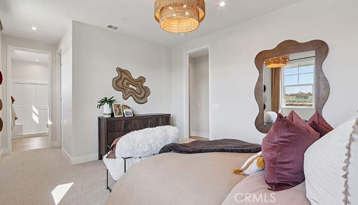 18318 Mystic Court Riverside, CA 92508 - Photo 27 of 47 a bedroom with bed and flowerpot