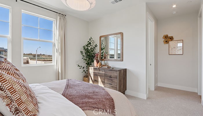 18318 Mystic Court Riverside, CA 92508 - Photo 29 of 47 a bedroom with a bed and a table in it