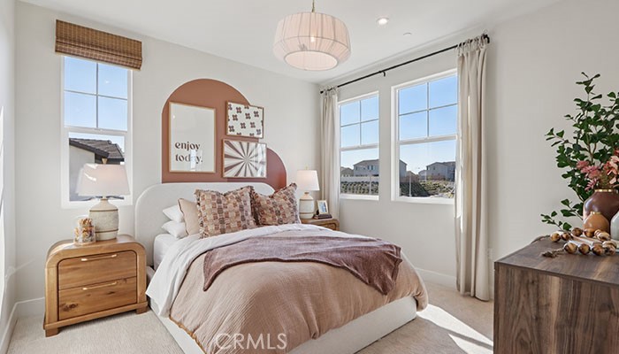 18318 Mystic Court Riverside, CA 92508 - Photo 31 of 47 a bedroom with a bed and a chandelier