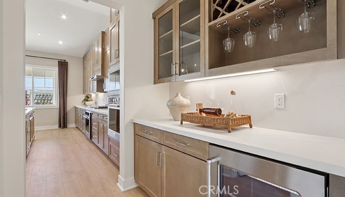 18318 Mystic Court Riverside, CA 92508 - Photo 39 of 47 a kitchen with a sink stove and cabinets