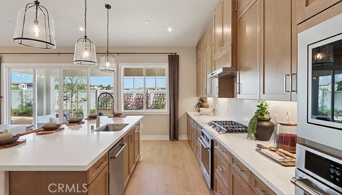 18318 Mystic Court Riverside, CA 92508 - Photo 41 of 47 a kitchen with counter top space appliances and windows