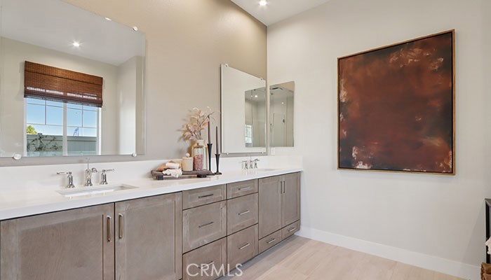 18318 Mystic Court Riverside, CA 92508 - Photo 5 of 47 a bathroom with a double vanity sink and a mirror