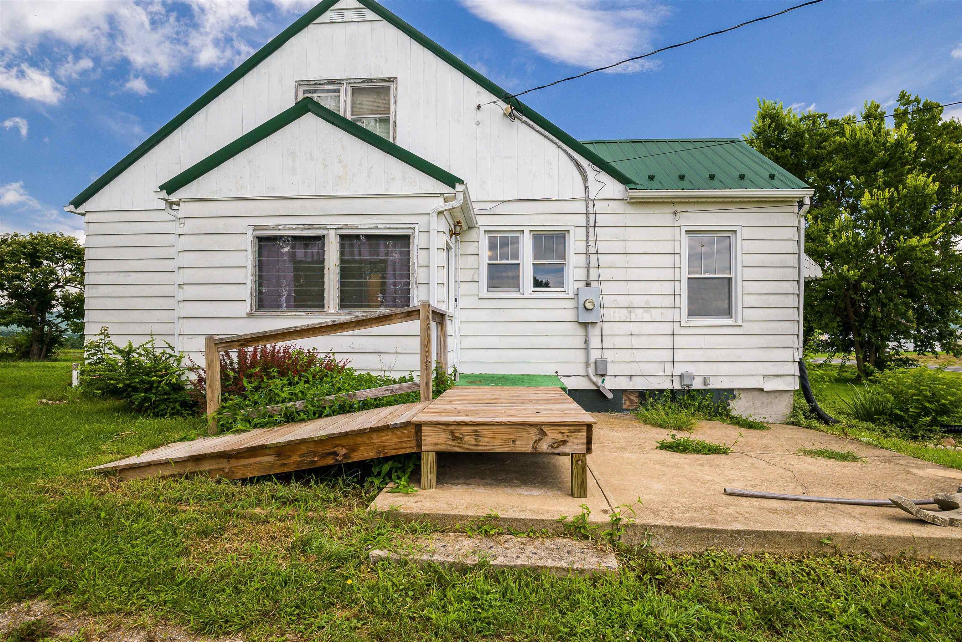 6507 East Point Road Elkton, VA 22827 - Photo 12 of 39 a view of a house with backyard and sitting area