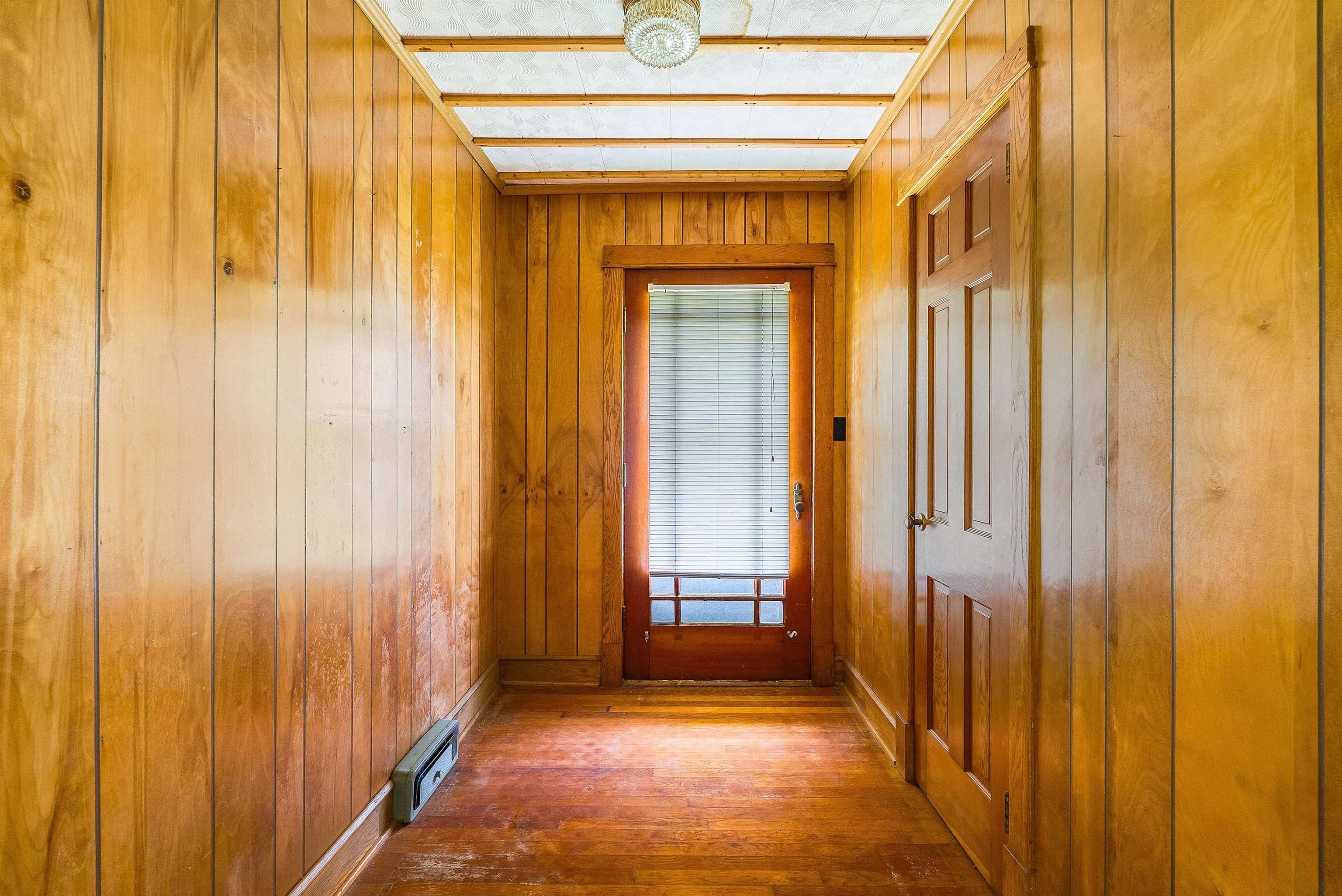 6507 East Point Road Elkton, VA 22827 - Photo 13 of 39 a view of a hallway with wooden walls