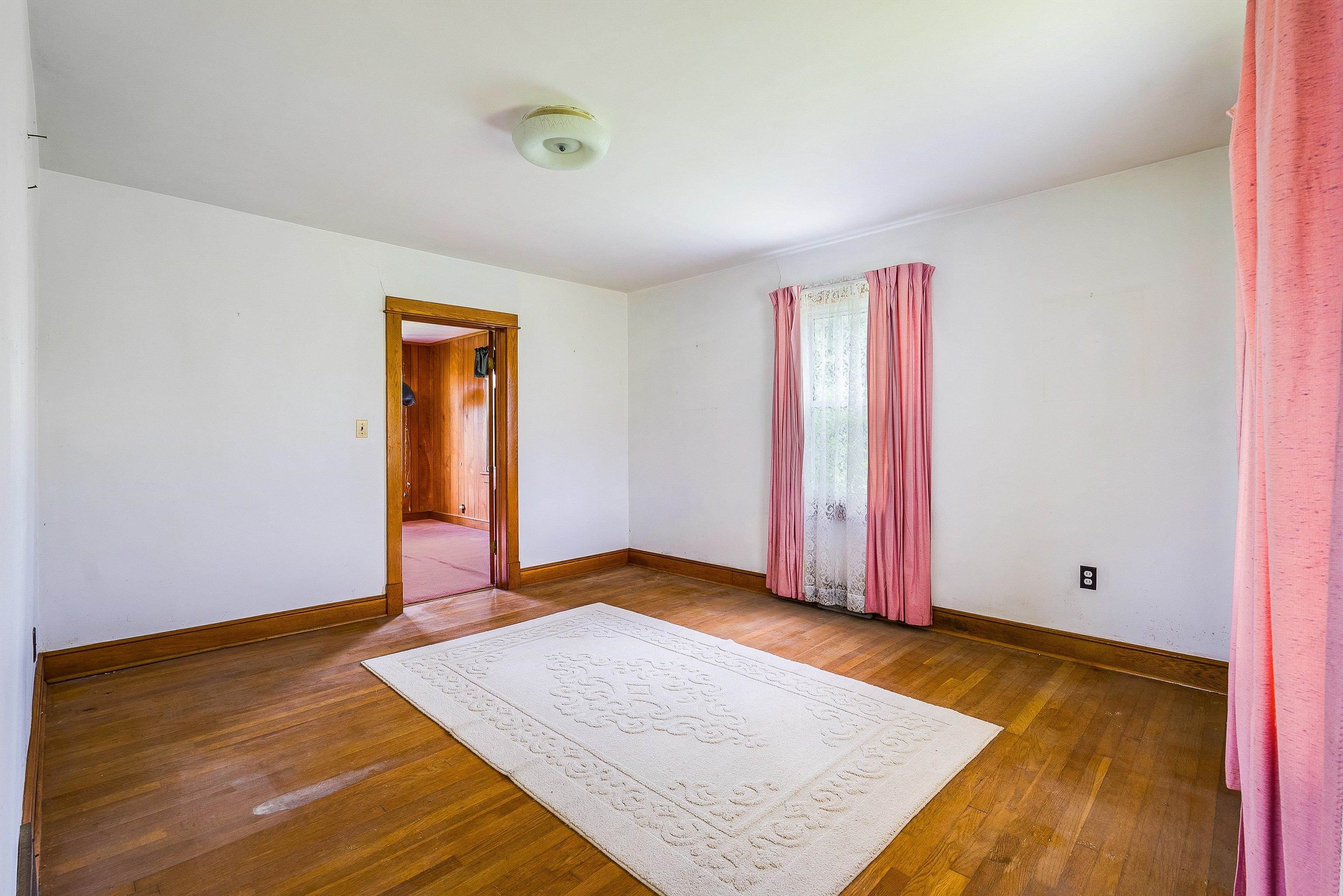 6507 East Point Road Elkton, VA 22827 - Photo 14 of 39 a view of an empty room with wooden floor