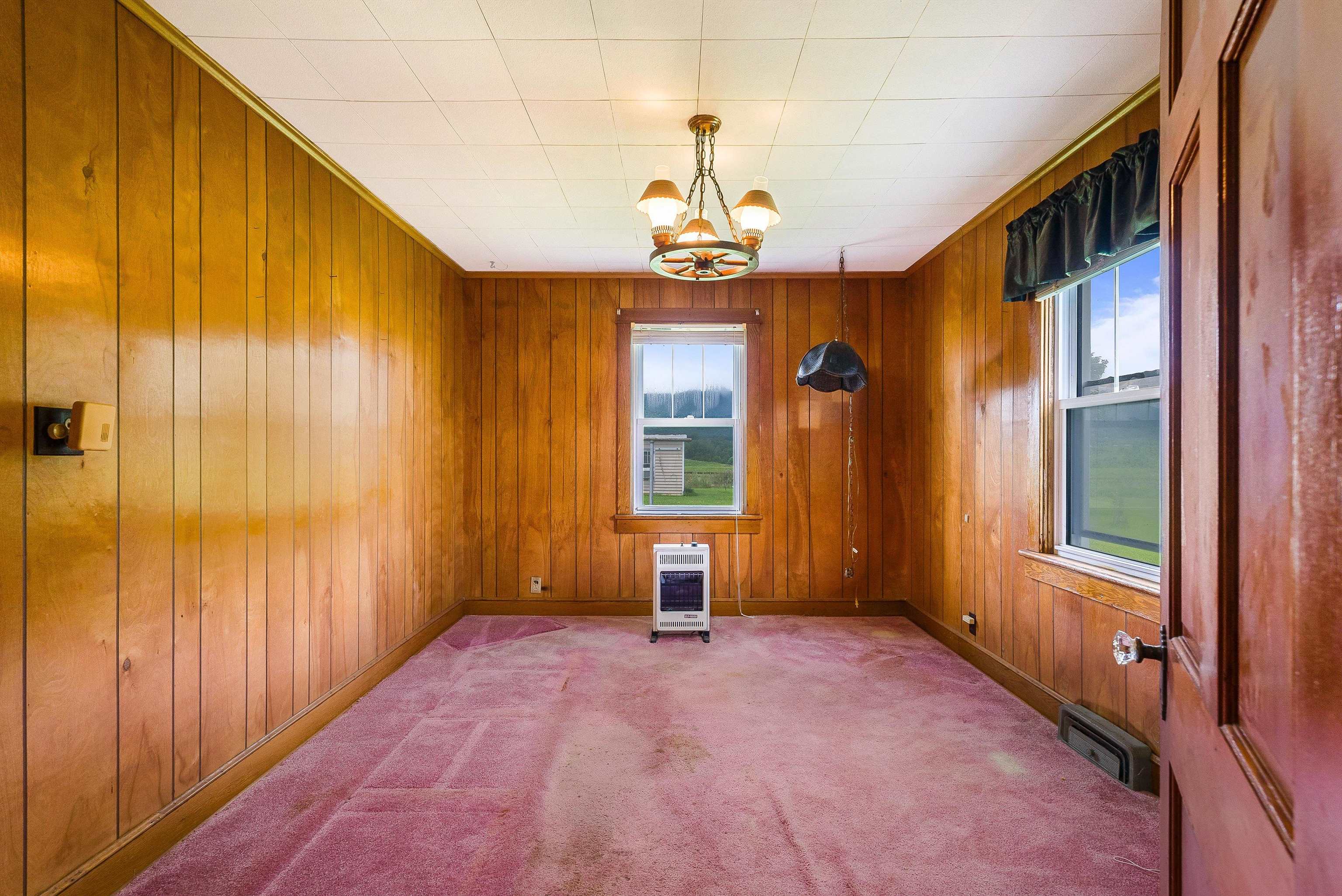 6507 East Point Road Elkton, VA 22827 - Photo 16 of 39 wooden floor in an empty room with a window