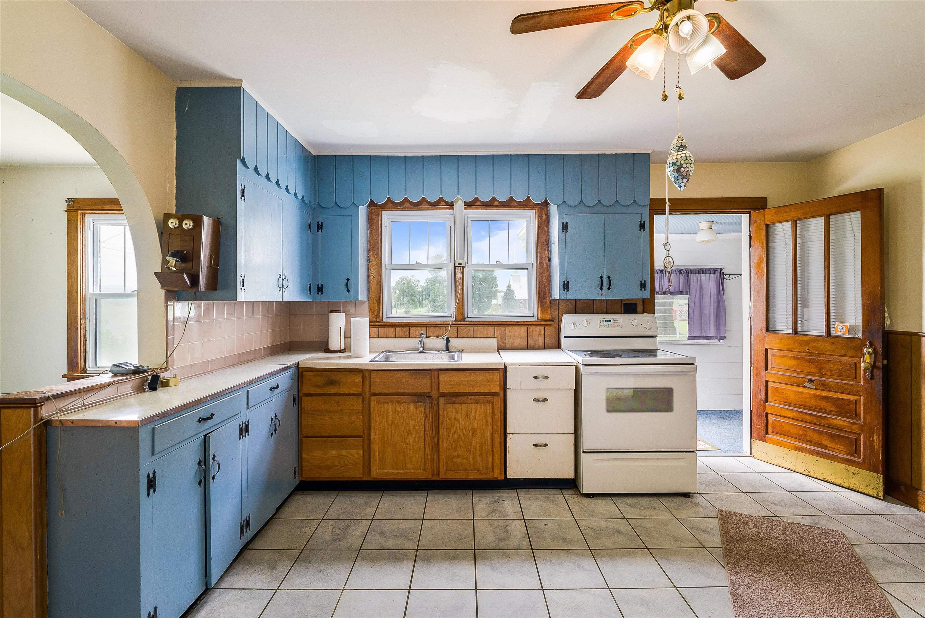 6507 East Point Road Elkton, VA 22827 - Photo 19 of 39 a kitchen with a stove sink and cabinets