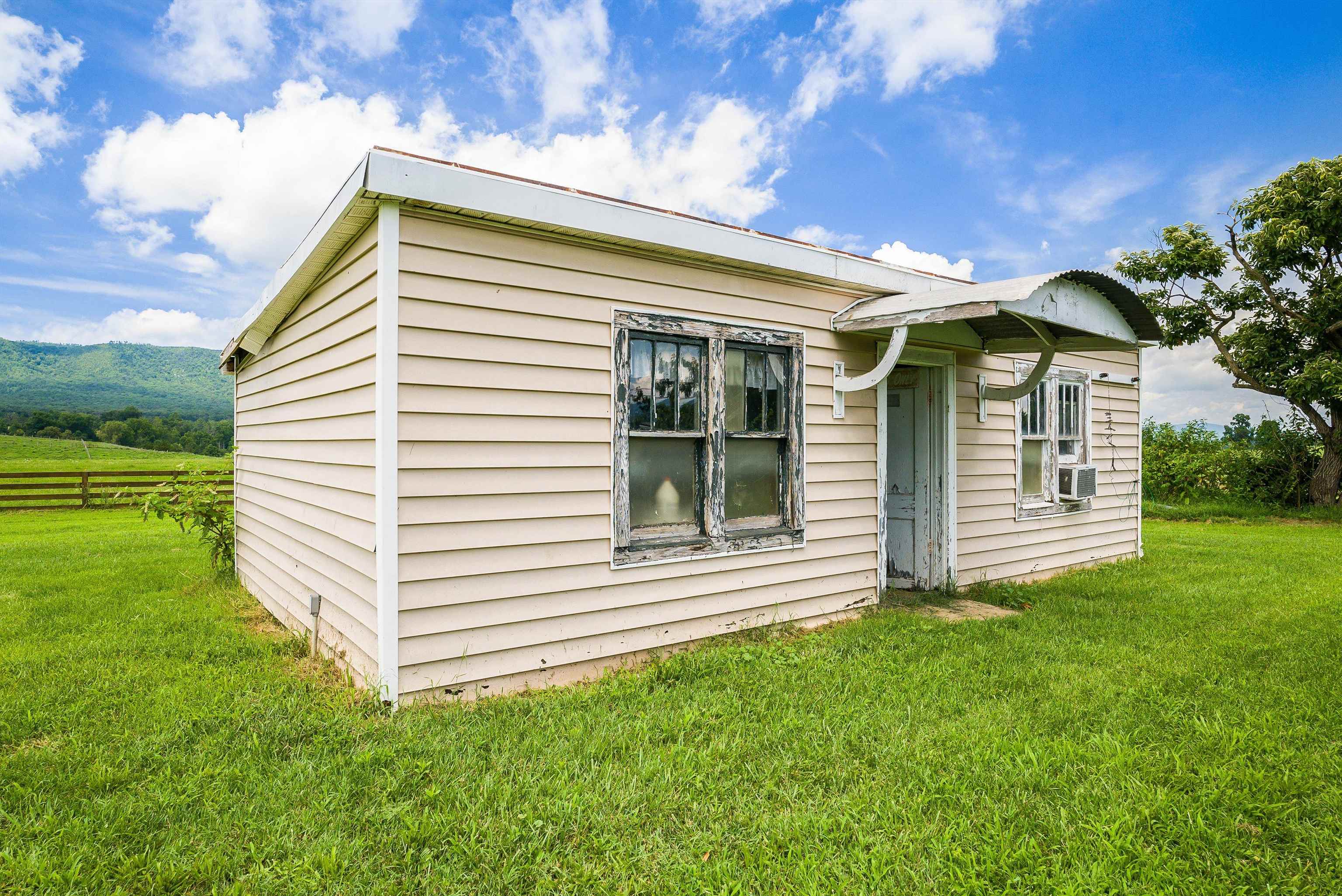 6507 East Point Road Elkton, VA 22827 - Photo 4 of 39 a front view of a house with a garden