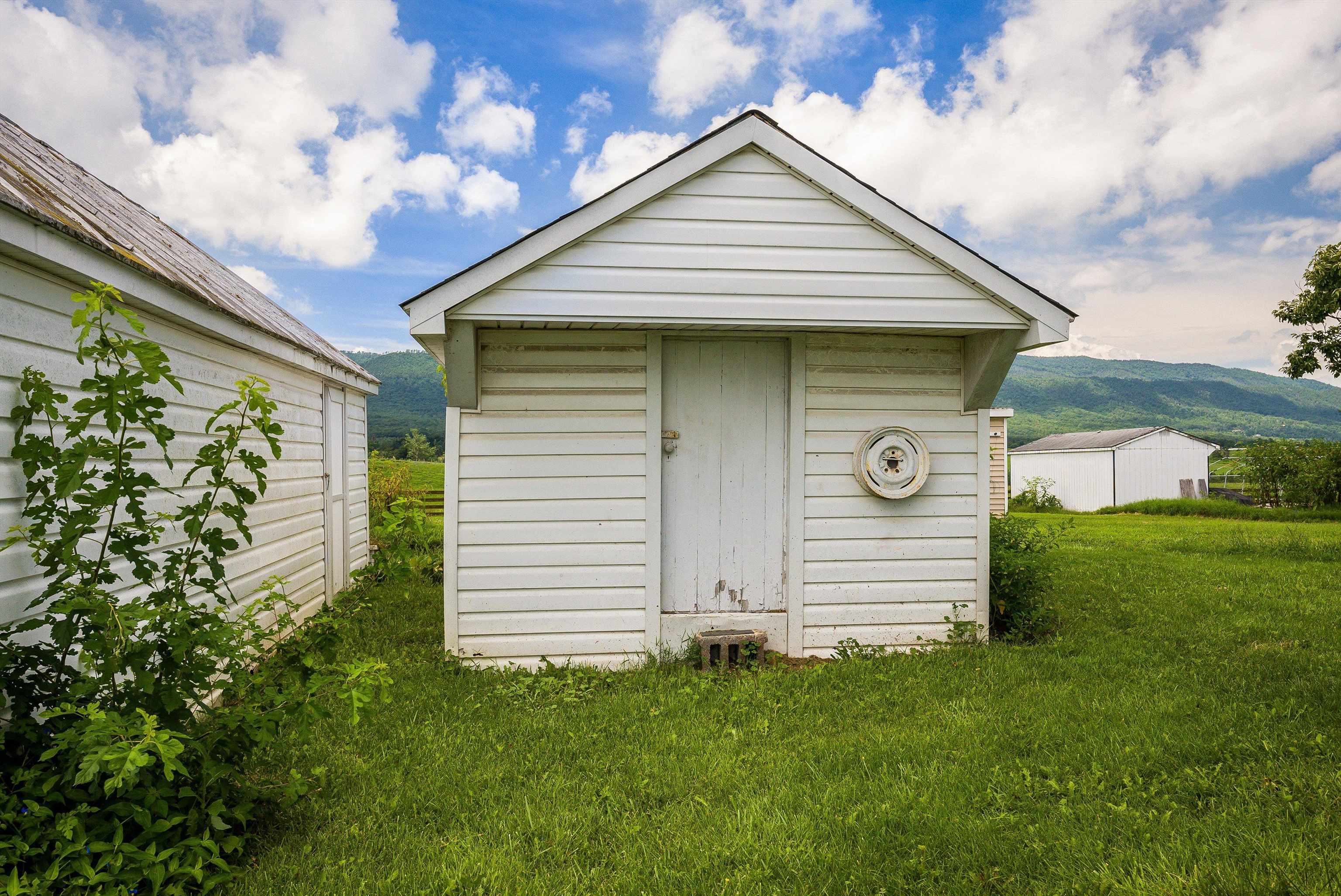 6507 East Point Road Elkton, VA 22827 - Photo 6 of 39 a front view of a house with a garden