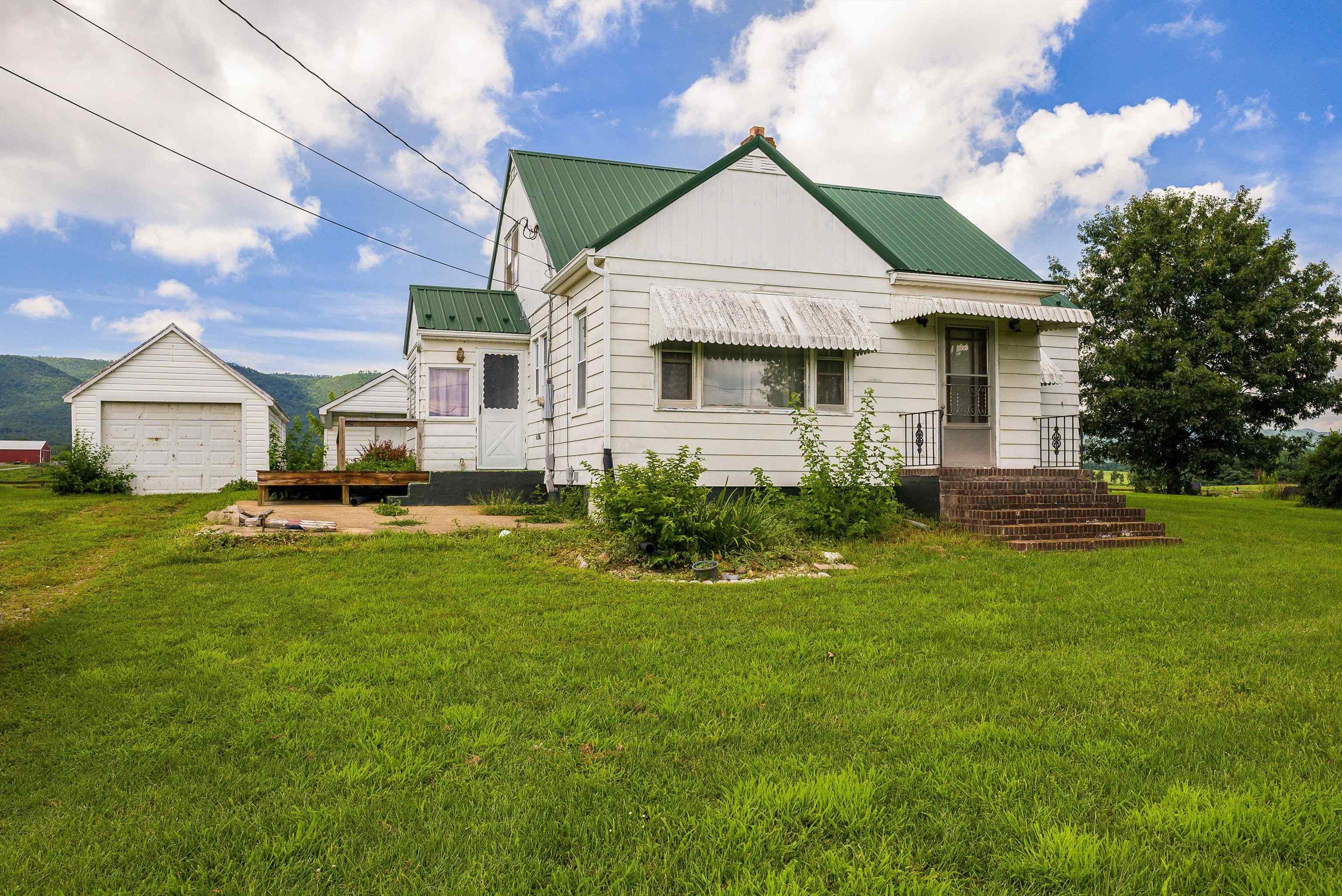 6507 East Point Road Elkton, VA 22827 - Photo 7 of 39 a front view of a house with a yard