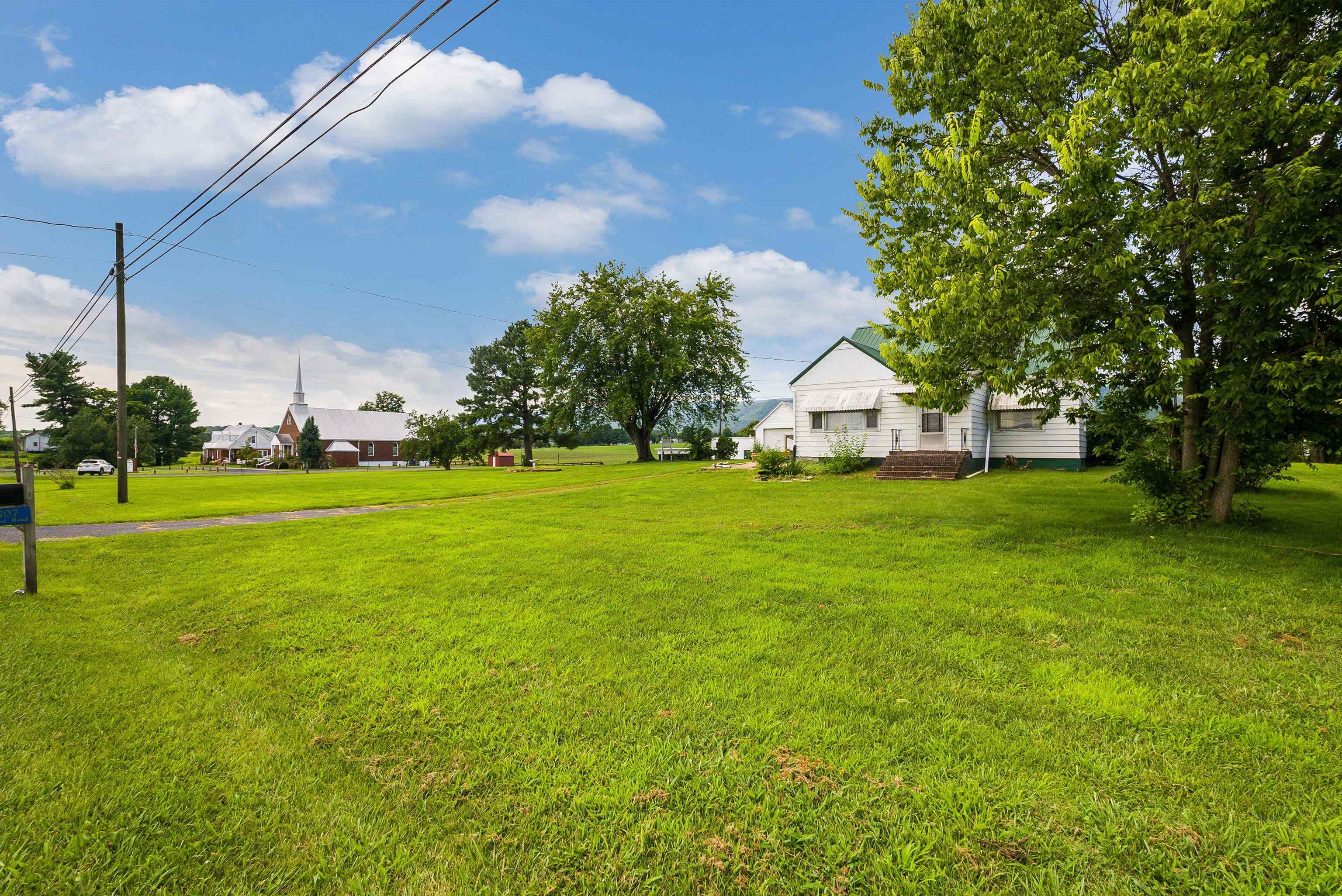 6507 East Point Road Elkton, VA 22827 - Photo 9 of 39 a view of a house with a big yard and potted plants