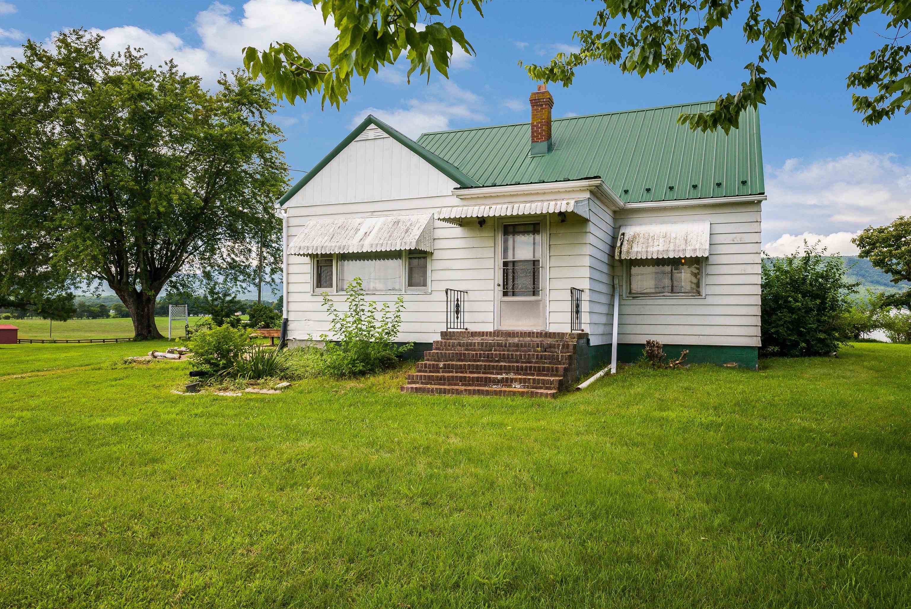 6507 East Point Road Elkton, VA 22827 - Photo 10 of 39 a front view of a house with a garden