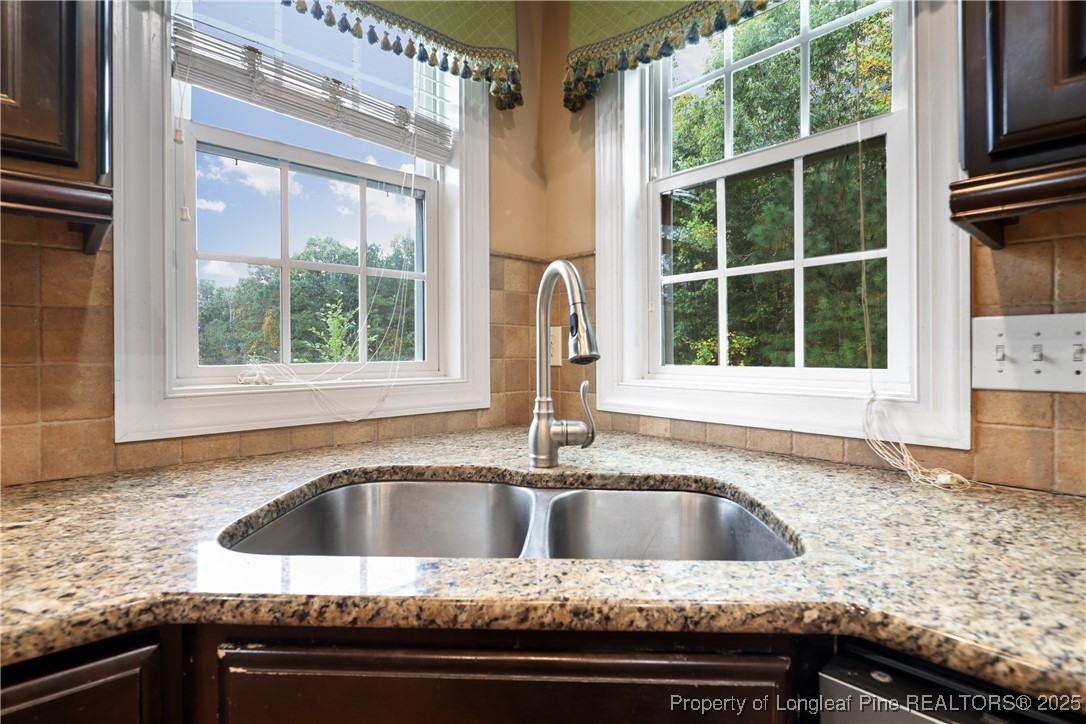 7124 Holmfield Road Fayetteville, NC 28306 - Photo 14 of 45 a kitchen sink sitting next to a window