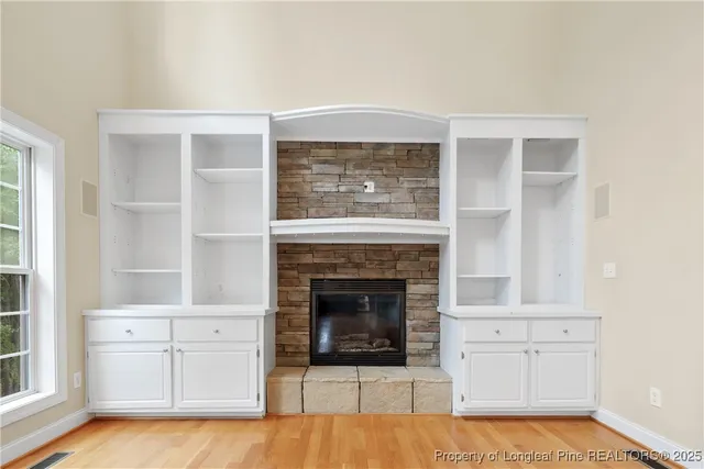 a bathroom with a granite countertop double vanity sink and a mirror