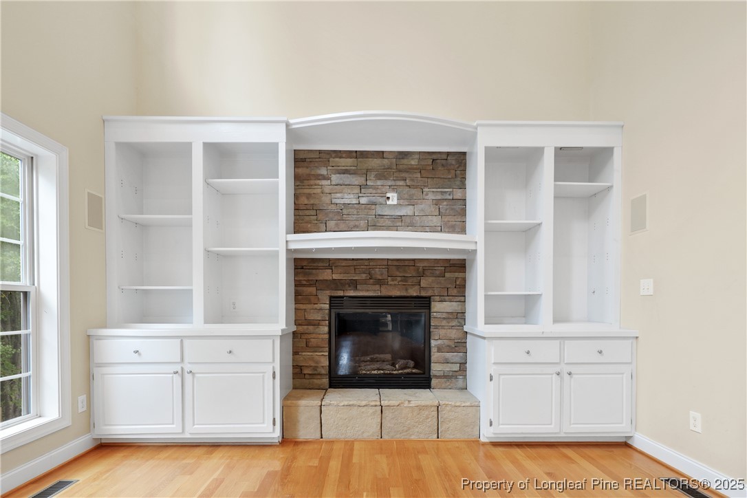 7124 Holmfield Road Fayetteville, NC 28306 - Photo 19 of 45 a living room with furniture and a fireplace