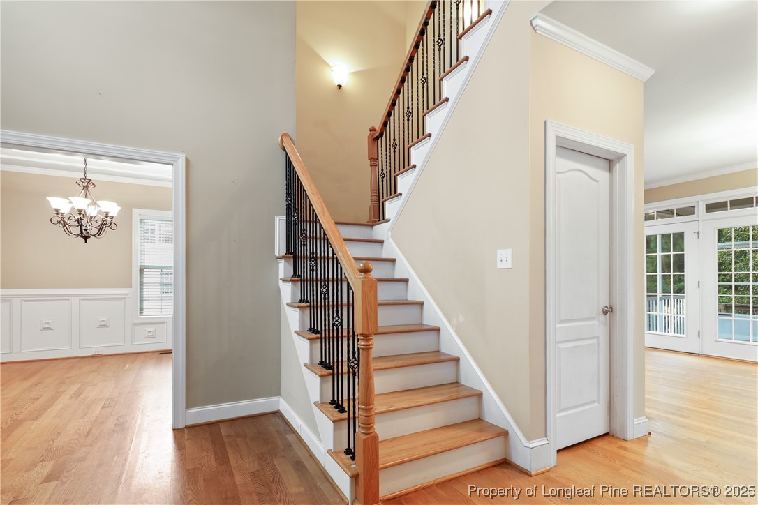 7124 Holmfield Road Fayetteville, NC 28306 - Photo 23 of 45 a view of a hallway with wooden floor and staircase