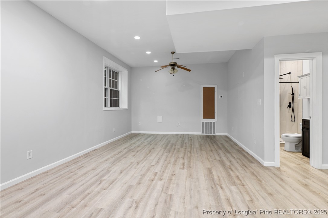 7124 Holmfield Road Fayetteville, NC 28306 - Photo 38 of 45 wooden floor in an empty room with a window