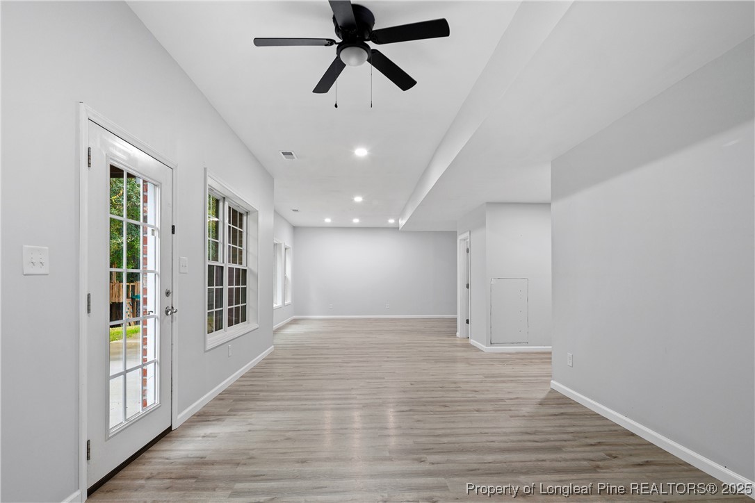 7124 Holmfield Road Fayetteville, NC 28306 - Photo 39 of 45 wooden floor in an empty room with a window
