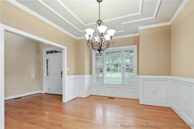 a kitchen with granite countertop stainless steel appliances a sink stove and cabinets