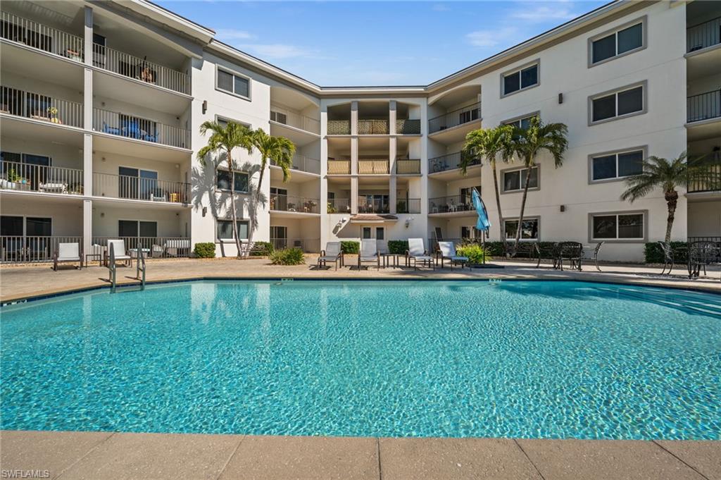 1100 Pine Ridge Road, Unit B103 Naples, FL 34108 - Photo 36 of 38 a house view with garden space