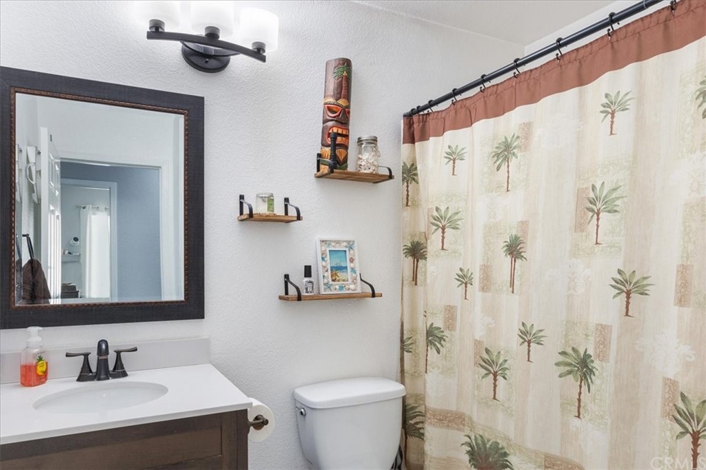 43176 Corte Calanda Temecula, CA 92592 - Photo 14 of 26 a bathroom with a sink toilet and shower