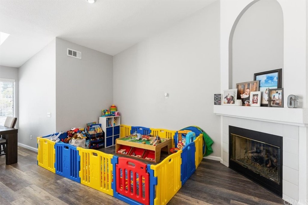 43176 Corte Calanda Temecula, CA 92592 - Photo 7 of 26 a living room with furniture and a fireplace