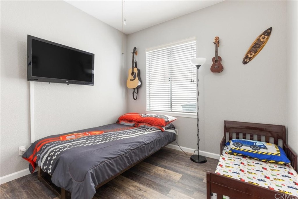 43176 Corte Calanda Temecula, CA 92592 - Photo 9 of 26 a bedroom with a bed and flat screen tv