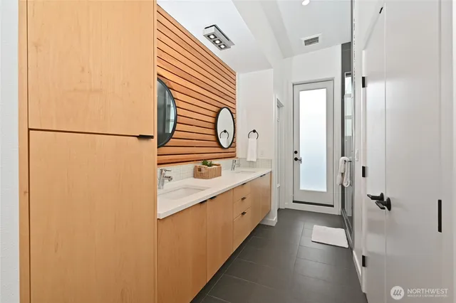 a kitchen with a refrigerator and a sink