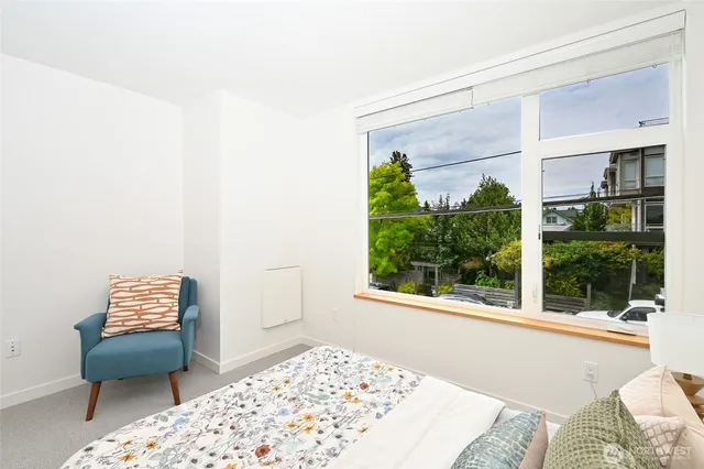 a living room with a couch and a window