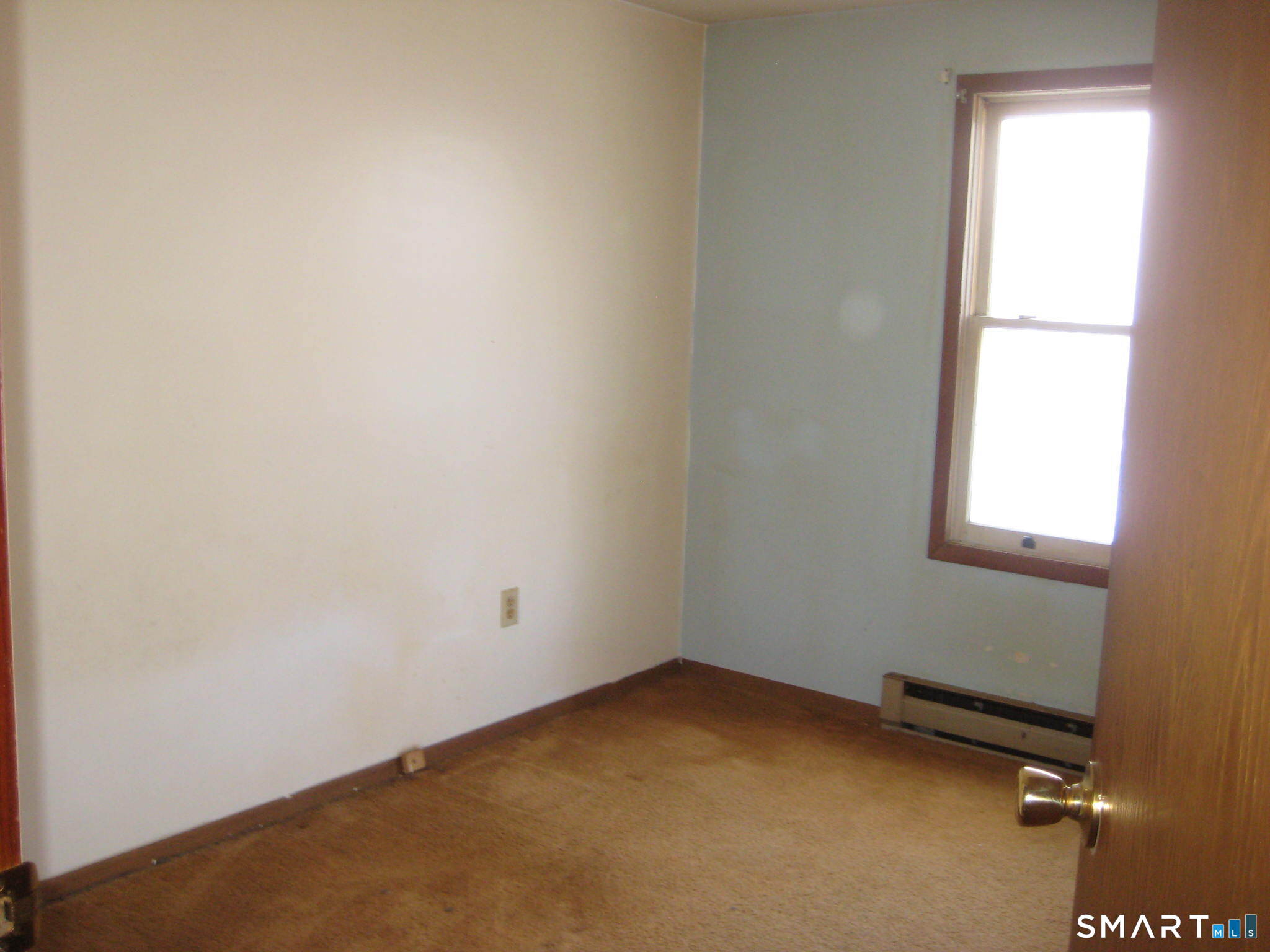 645 Buff Cap Road Tolland, CT 06084 - Photo 7 of 10 an empty room with a window