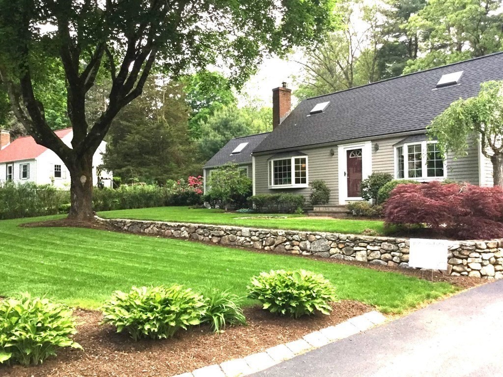 8 Springhill Road Wayland, MA 01778 - Photo 39 of 44 a front view of a house with a garden