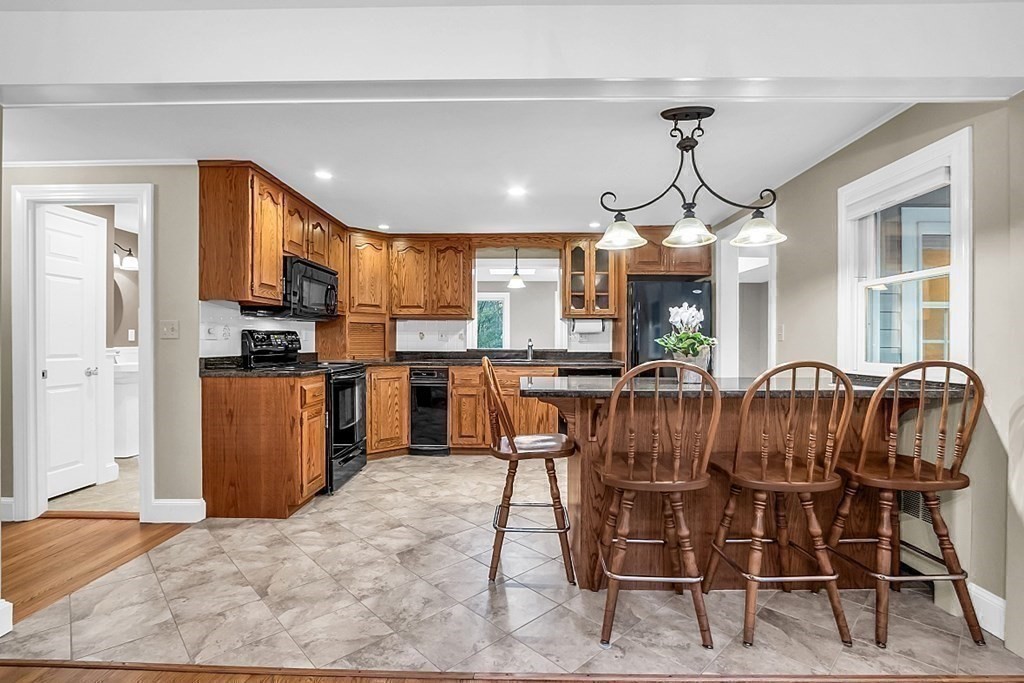 8 Springhill Road Wayland, MA 01778 - Photo 8 of 44 a view of kitchen with dining room and wooden floor