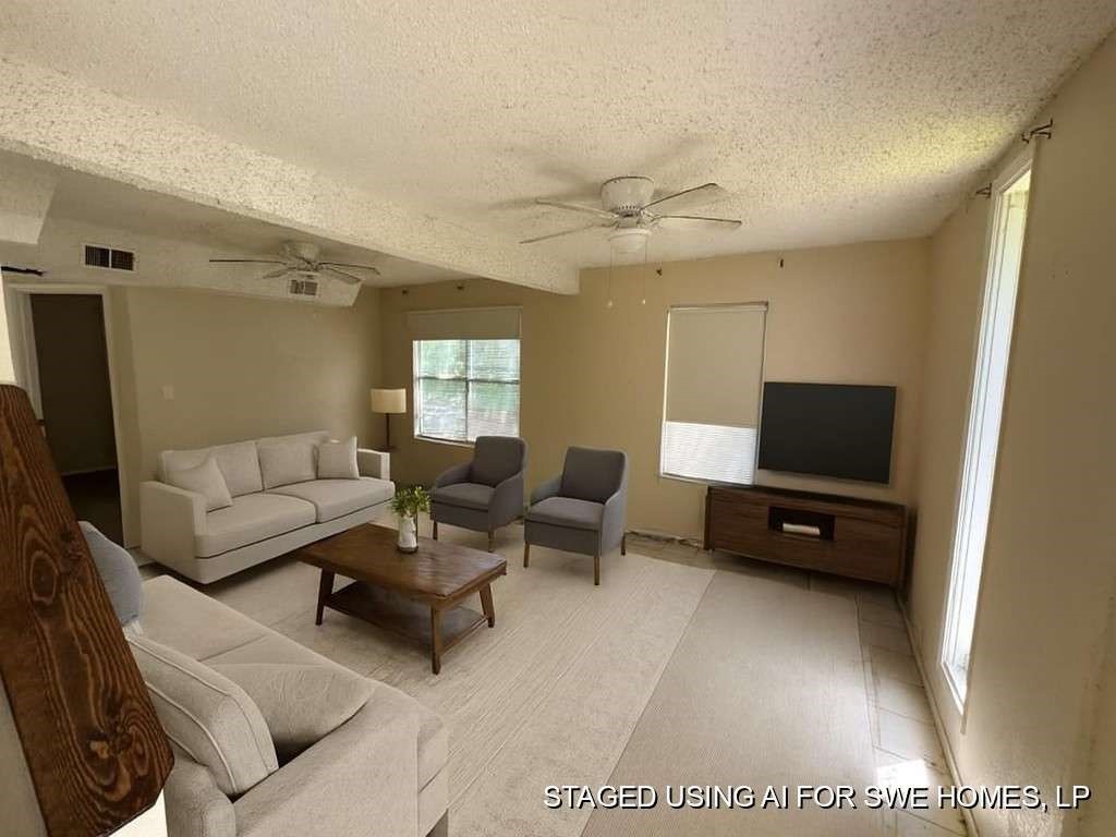 6133 Inca Drive Mabank, TX 75156 - Photo 5 of 10 a living room with furniture and a flat screen tv
