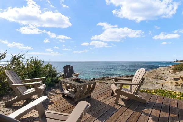 a view of a backyard with sitting area