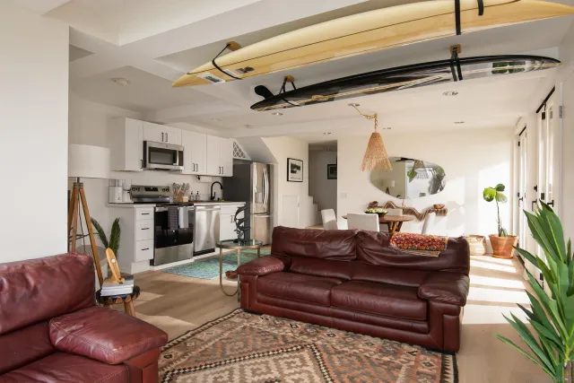 a kitchen with stainless steel appliances granite countertop a stove a microwave and a refrigerator