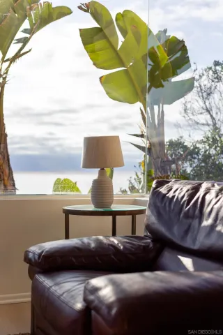 a room with a table chairs and wooden floor