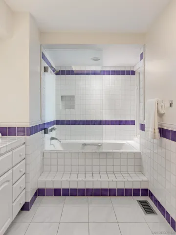 a bathroom with a sink a mirror and a toilet