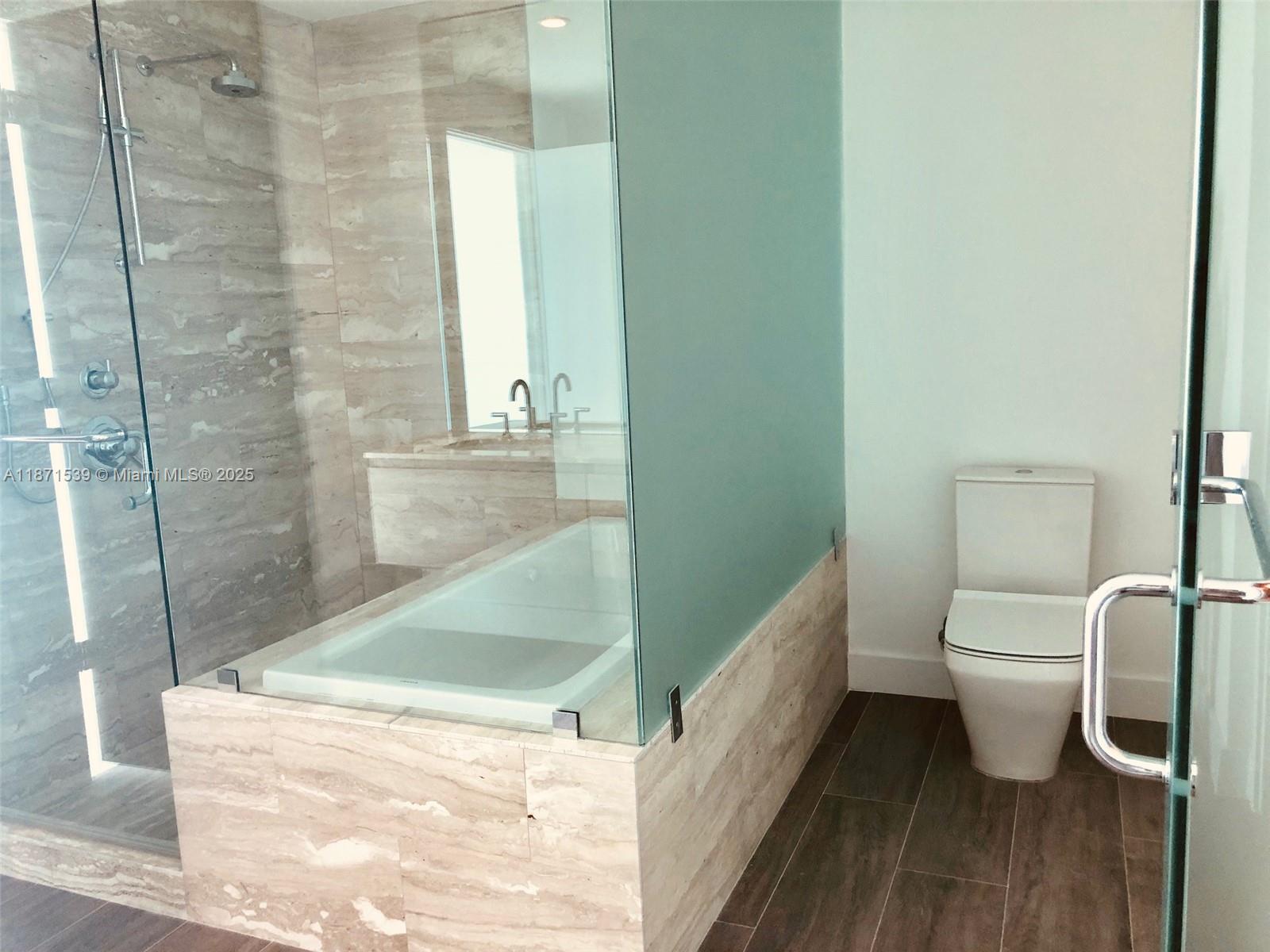 2900 Northeast 7th Avenue, Unit 2404 Miami, FL 33137 - Photo 12 of 42 a bathroom with a toilet and a shower